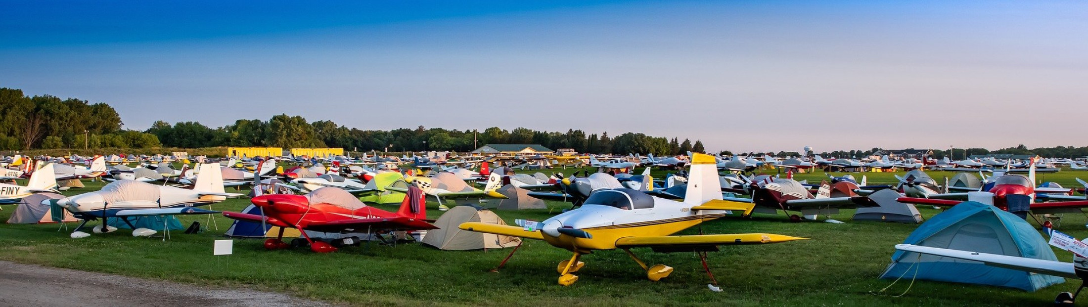 contact-airplanes-in-fields-with-tents.jpg
